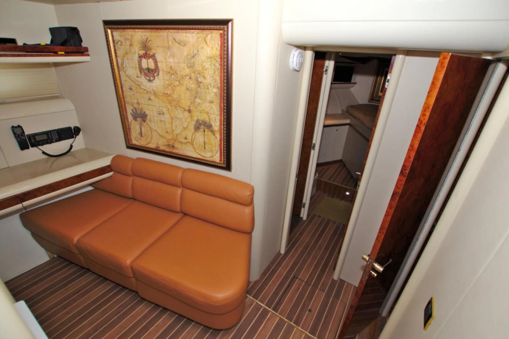 an orange couch in a room aboard CHRISTMAS SPIRIT Yacht for Sale