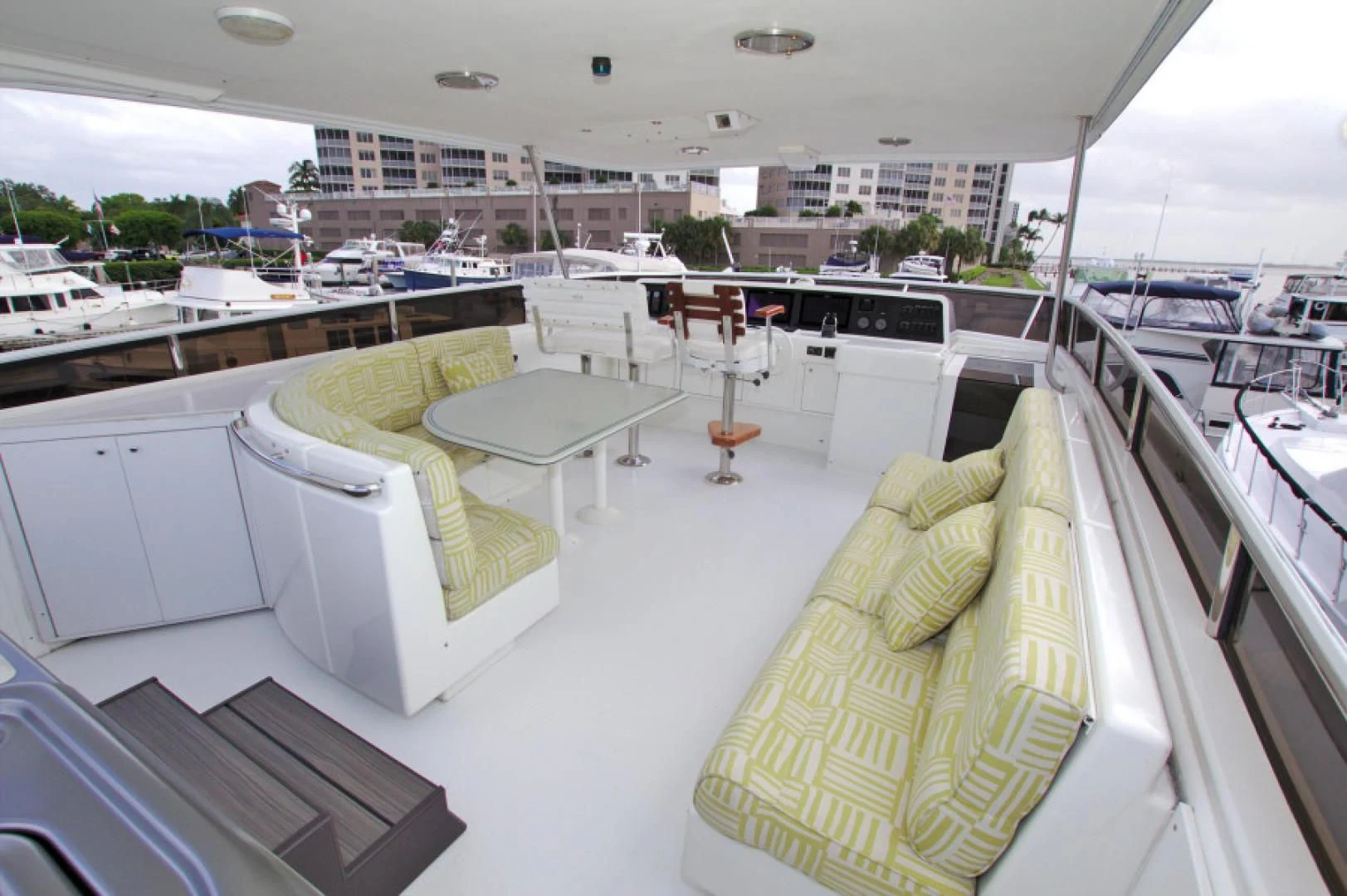 a room with a bed and a table with chairs on it aboard CHRISTMAS SPIRIT Yacht for Sale