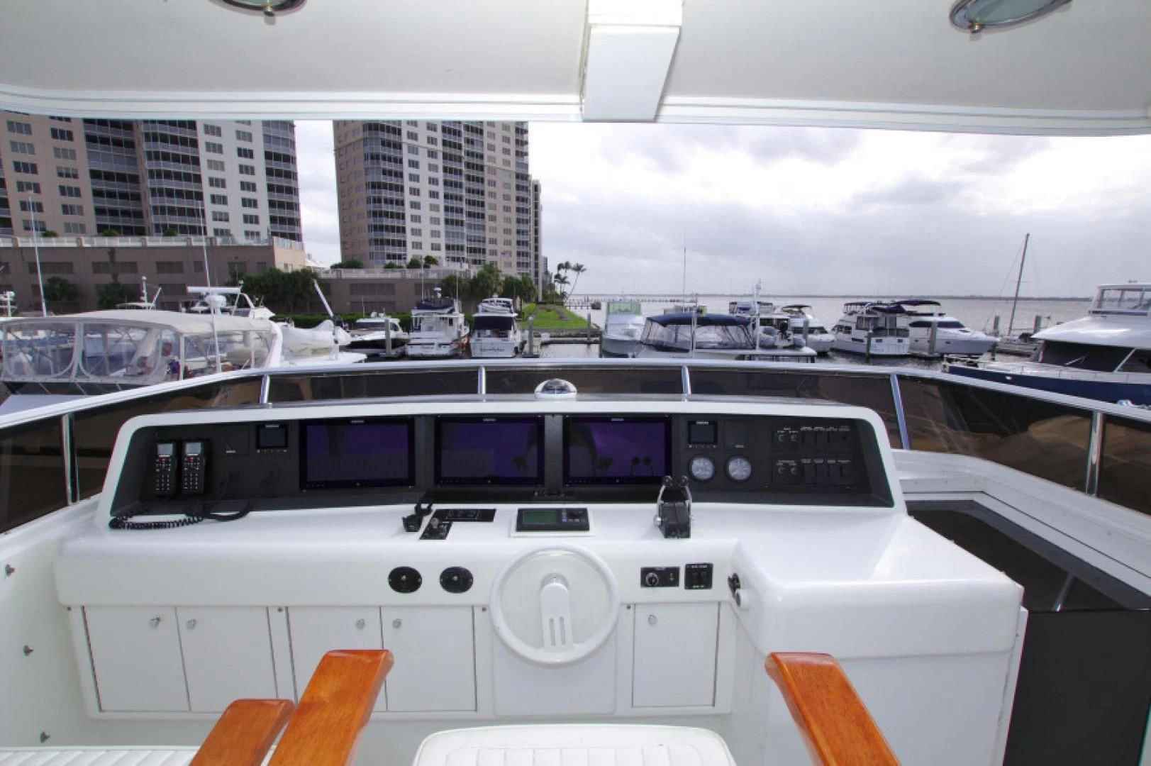 a white rectangular object with a screen and a black screen with a purple screen and white text on aboard CHRISTMAS SPIRIT Yacht for Sale