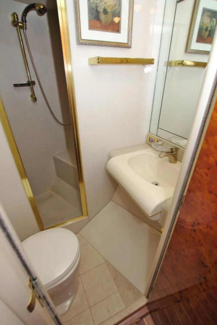 a bathroom with a sink and a mirror aboard CHRISTMAS SPIRIT Yacht for Sale