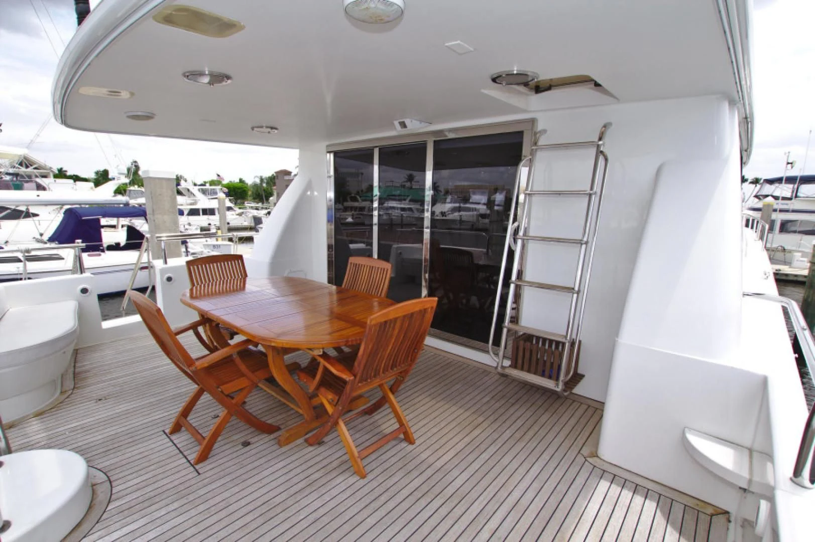 a room with a table chairs and a large window aboard CHRISTMAS SPIRIT Yacht for Sale