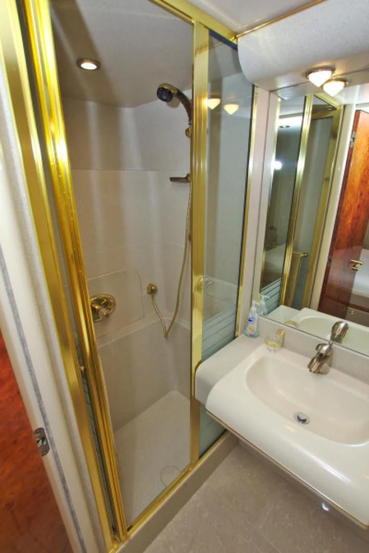 a bathroom with a shower and sink aboard CHRISTMAS SPIRIT Yacht for Sale