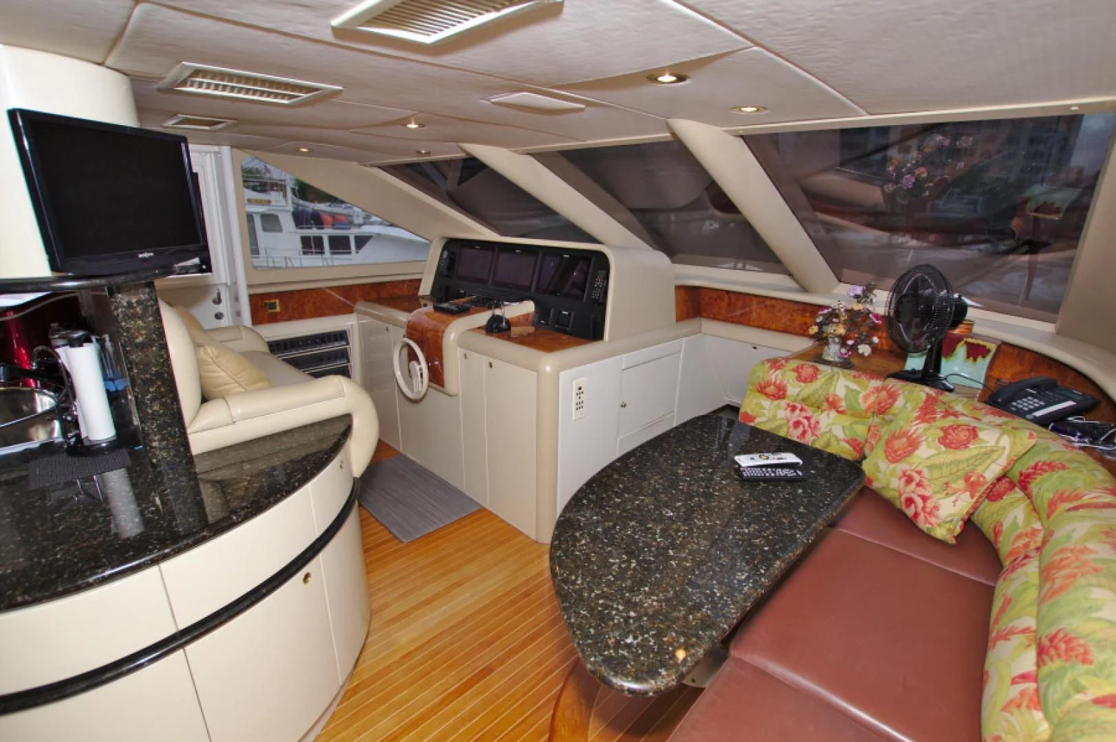 a room with a couch and a tv aboard CHRISTMAS SPIRIT Yacht for Sale