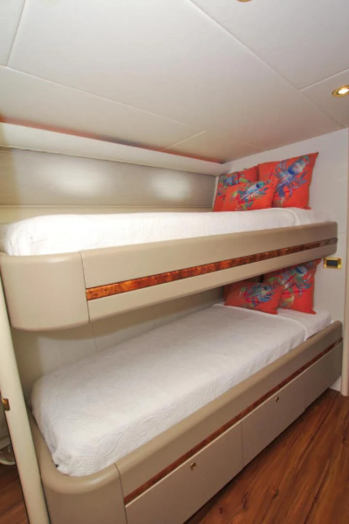 a bed with a white sheet aboard CHRISTMAS SPIRIT Yacht for Sale