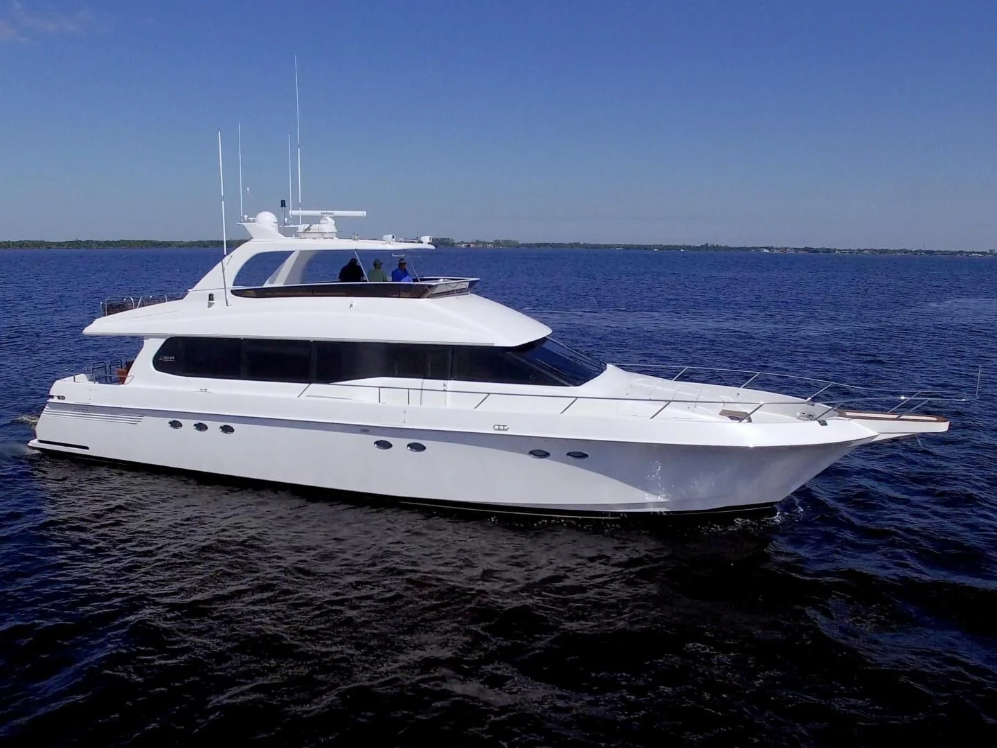 a white yacht in the water aboard CHRISTMAS SPIRIT Yacht for Sale