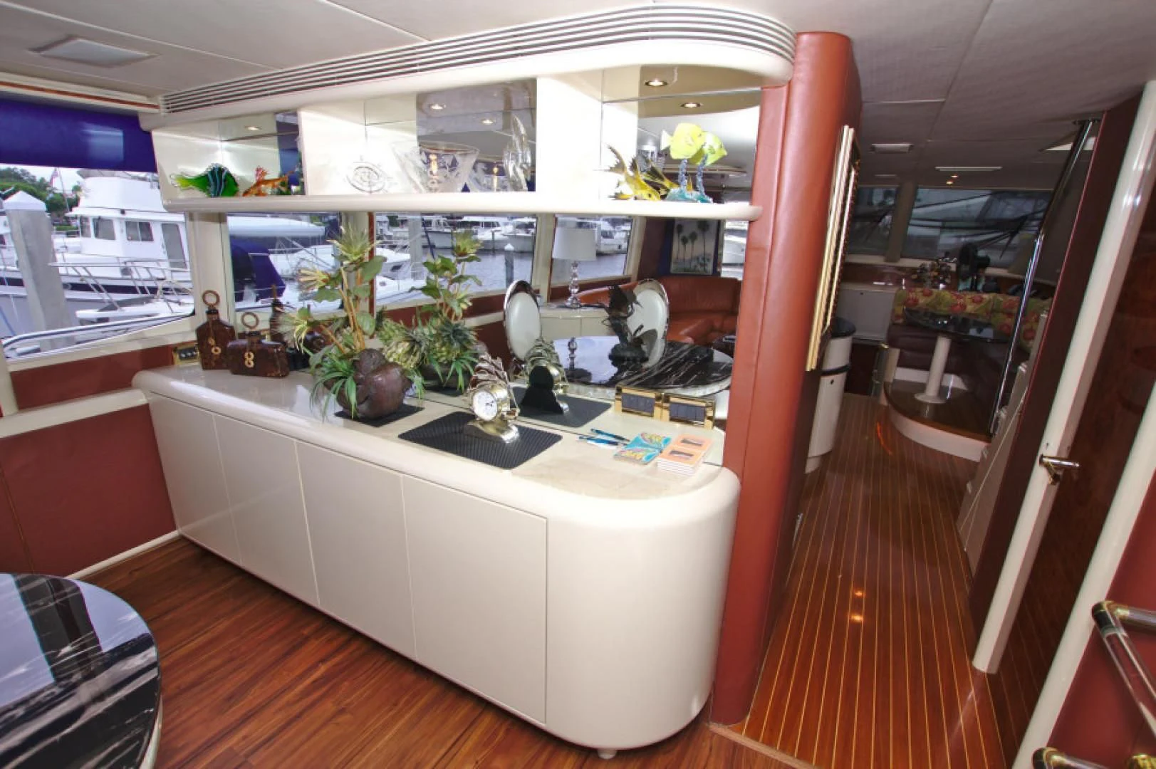 a large white bathroom with a large red door aboard CHRISTMAS SPIRIT Yacht for Sale