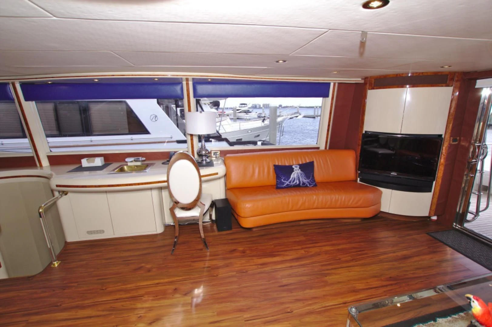 an empty living room with a couch and a tv aboard CHRISTMAS SPIRIT Yacht for Sale