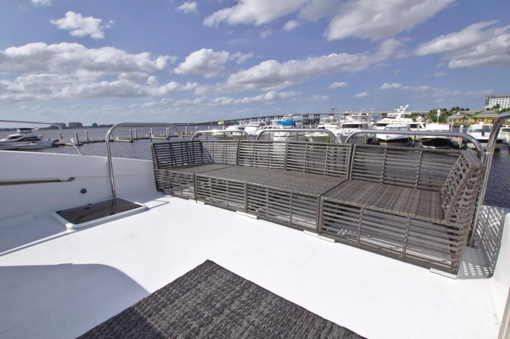 a deck with a view of a marina and boats aboard CHRISTMAS SPIRIT Yacht for Sale