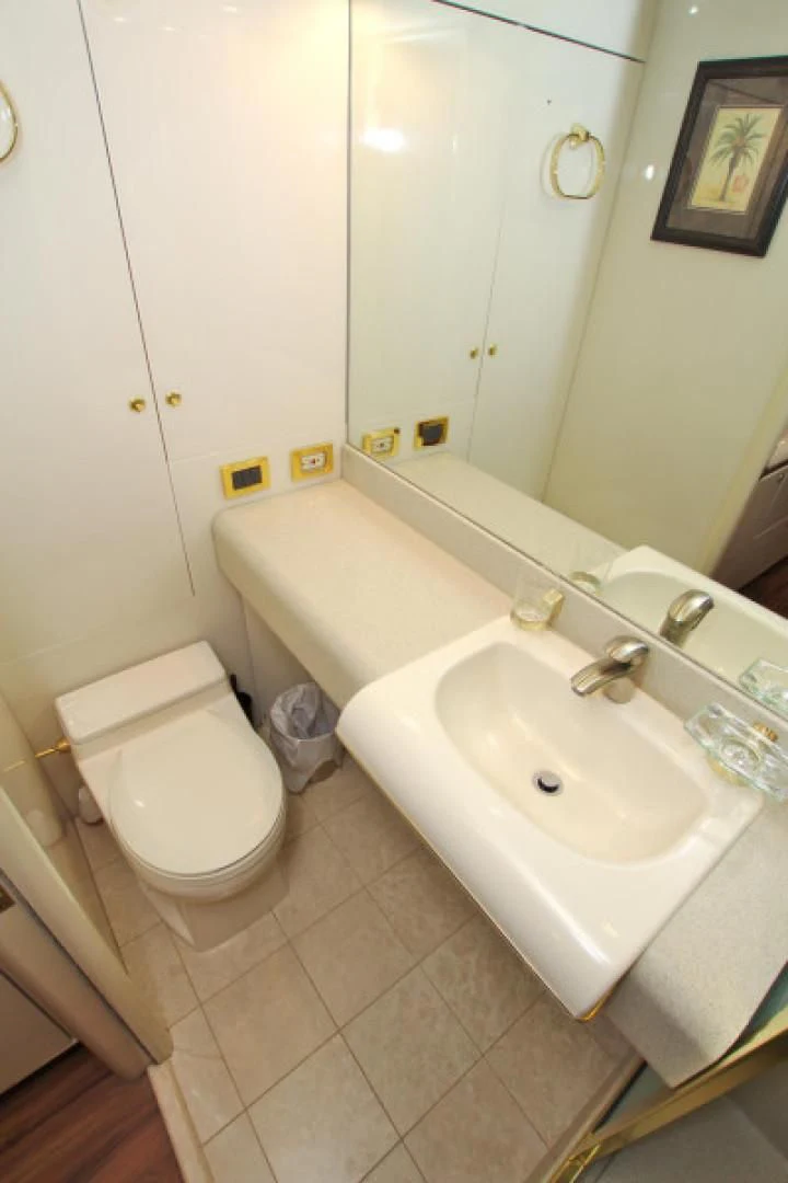 a bathroom with a sink and toilet aboard CHRISTMAS SPIRIT Yacht for Sale