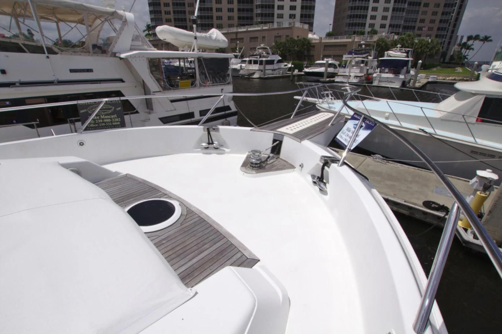 a large white boat in a harbor aboard CHRISTMAS SPIRIT Yacht for Sale