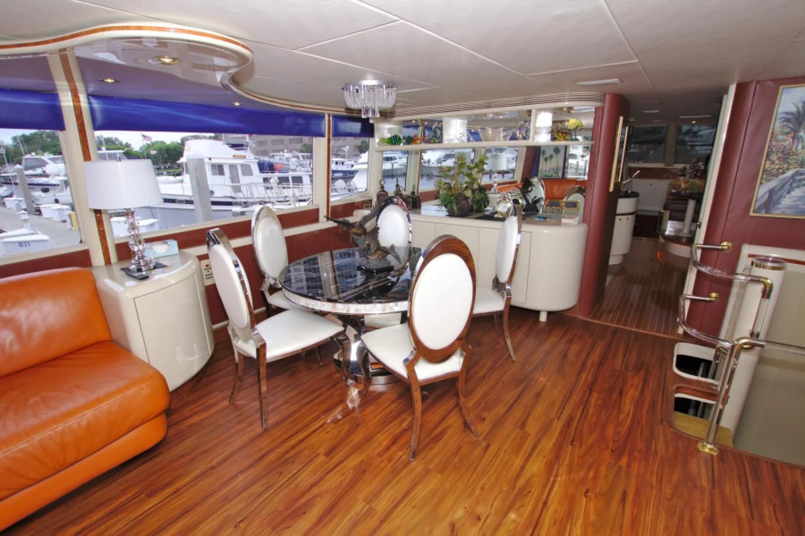 a room with a table chairs and a window aboard CHRISTMAS SPIRIT Yacht for Sale