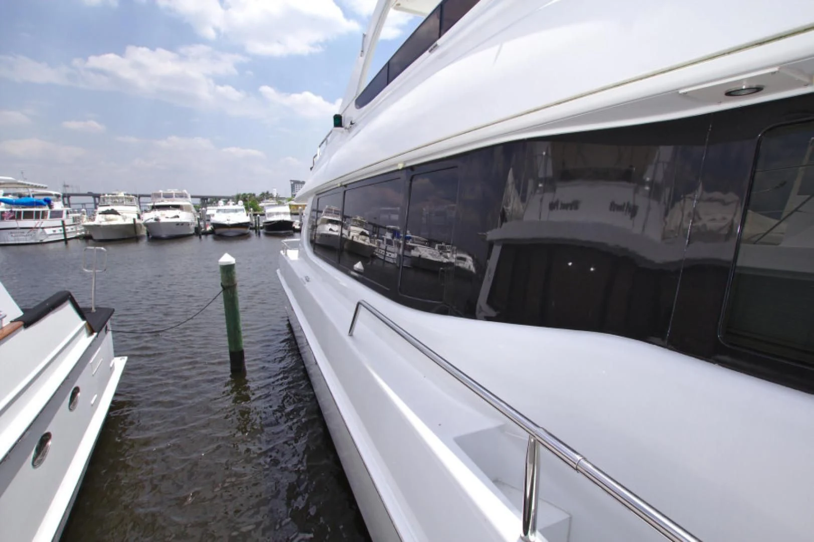 a boat is parked on the side of the water aboard CHRISTMAS SPIRIT Yacht for Sale