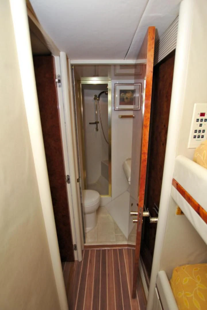 a bathroom with a red rug aboard CHRISTMAS SPIRIT Yacht for Sale