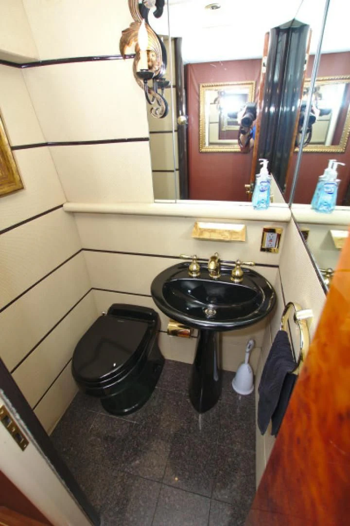a bathroom sink with a mirror aboard CHRISTMAS SPIRIT Yacht for Sale