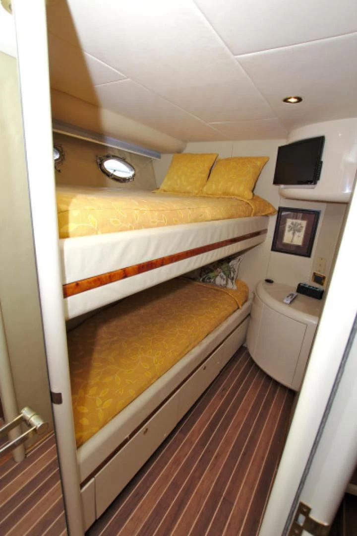 a room with a bed and a tv aboard CHRISTMAS SPIRIT Yacht for Sale