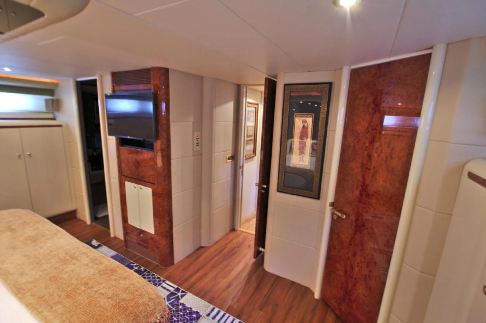 a bedroom with a tv and a bed aboard CHRISTMAS SPIRIT Yacht for Sale