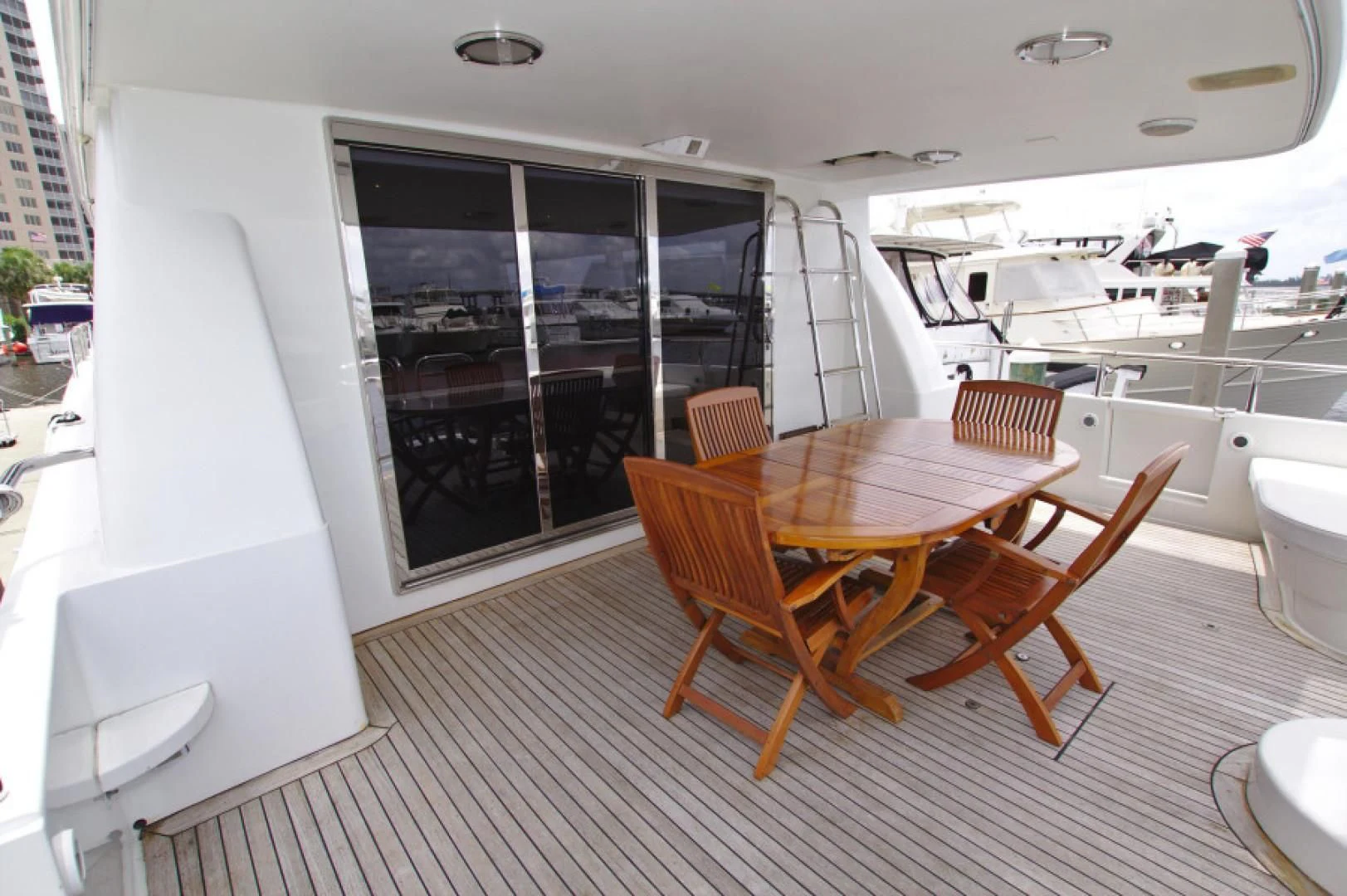 a table and chairs on a deck aboard CHRISTMAS SPIRIT Yacht for Sale