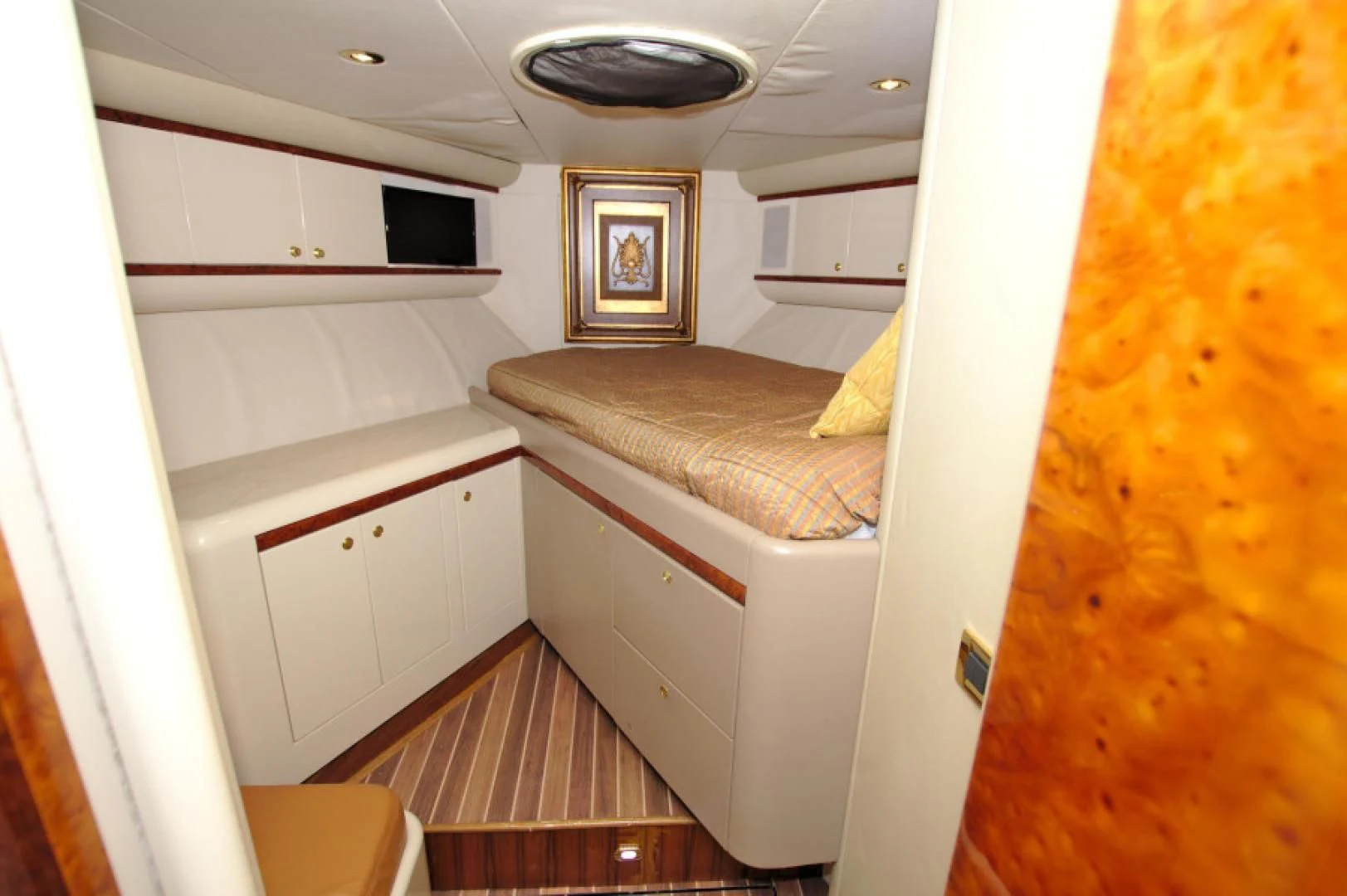 a room with a bed and a television aboard CHRISTMAS SPIRIT Yacht for Sale