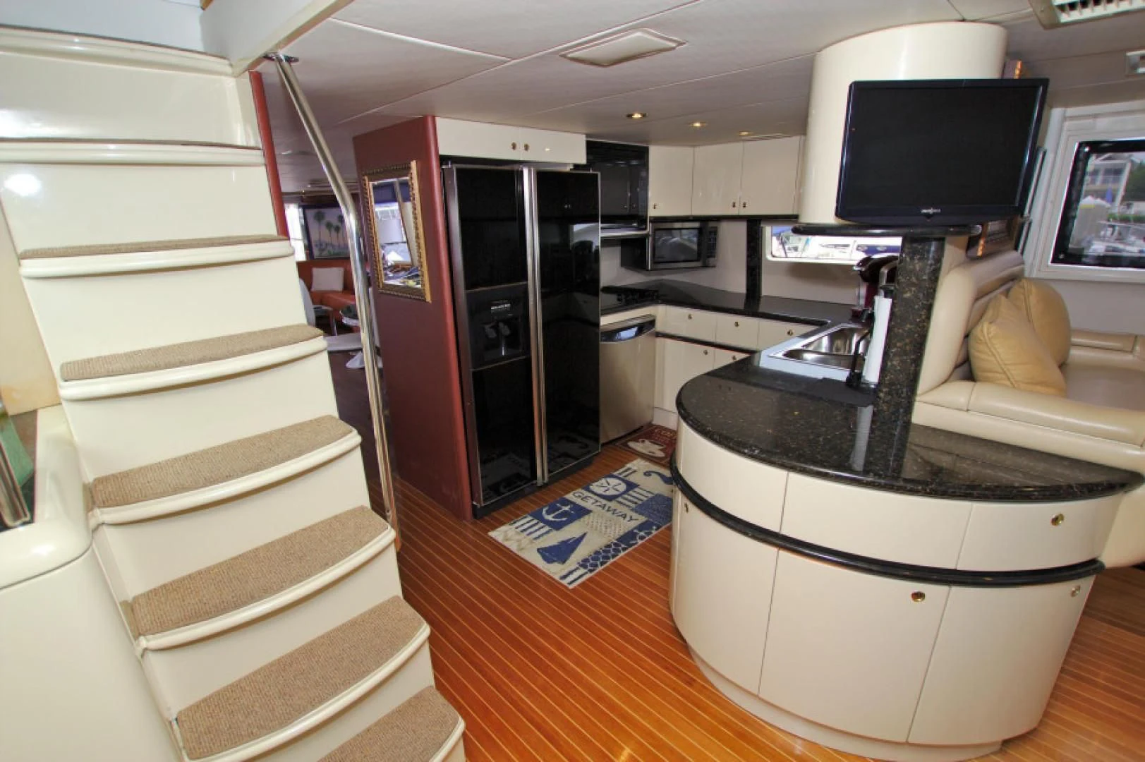 a small kitchen with a tv aboard CHRISTMAS SPIRIT Yacht for Sale