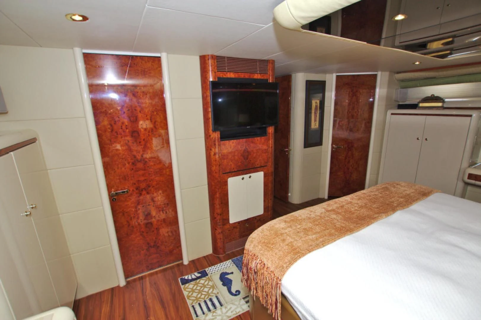 a bedroom with a bed and a microwave aboard CHRISTMAS SPIRIT Yacht for Sale