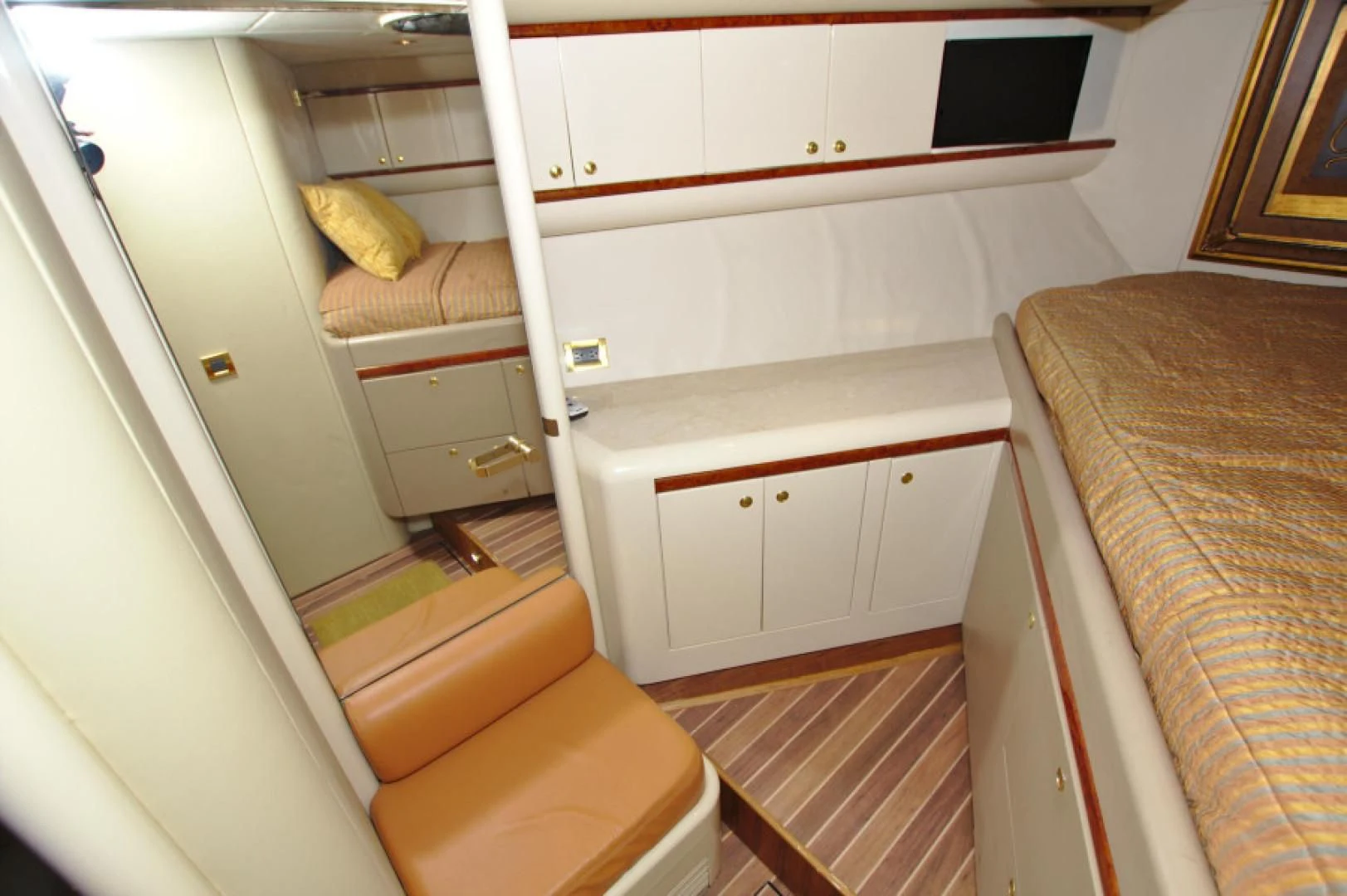 a small room with a bed and a chair aboard CHRISTMAS SPIRIT Yacht for Sale