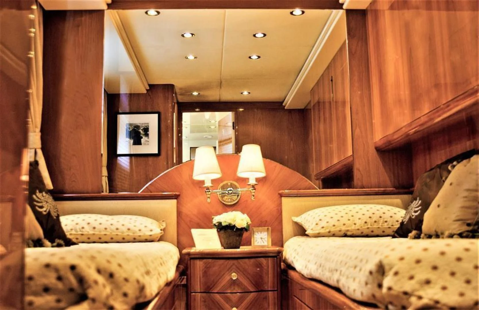a room with a bed and a chair aboard CAROBELLE Yacht for Sale