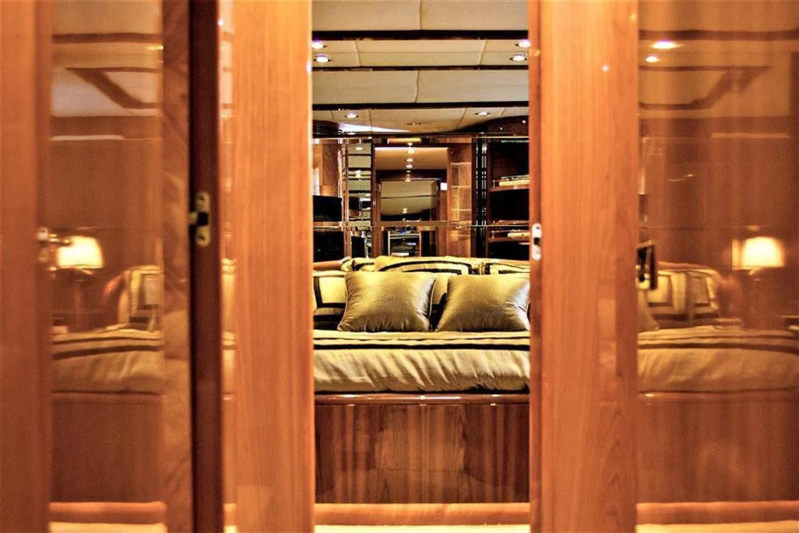 a room with a bed and a window aboard CAROBELLE Yacht for Sale