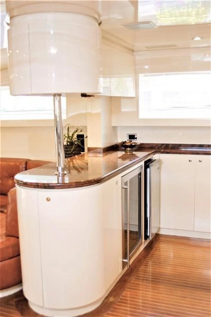 a kitchen with a large island aboard CAROBELLE Yacht for Sale