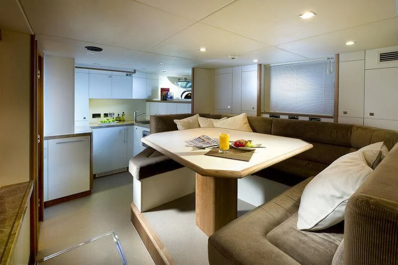 a kitchen and living room aboard ABOUT TIME Yacht for Sale