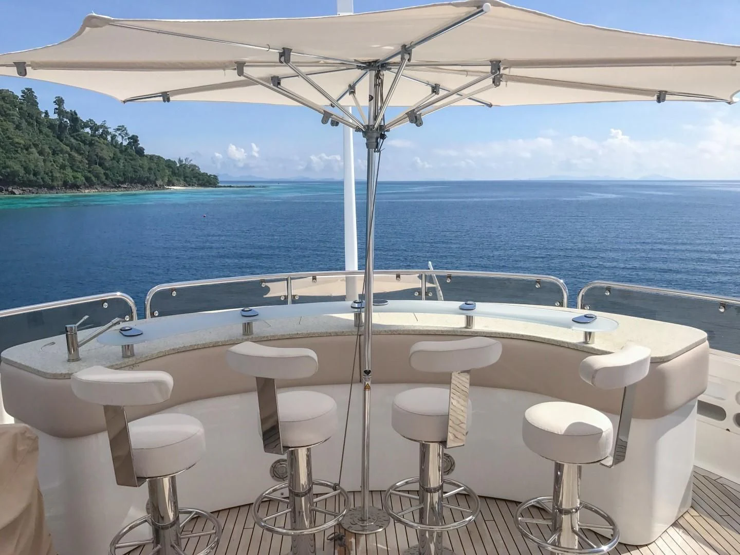 a boat with stools on the deck aboard ABOUT TIME Yacht for Sale