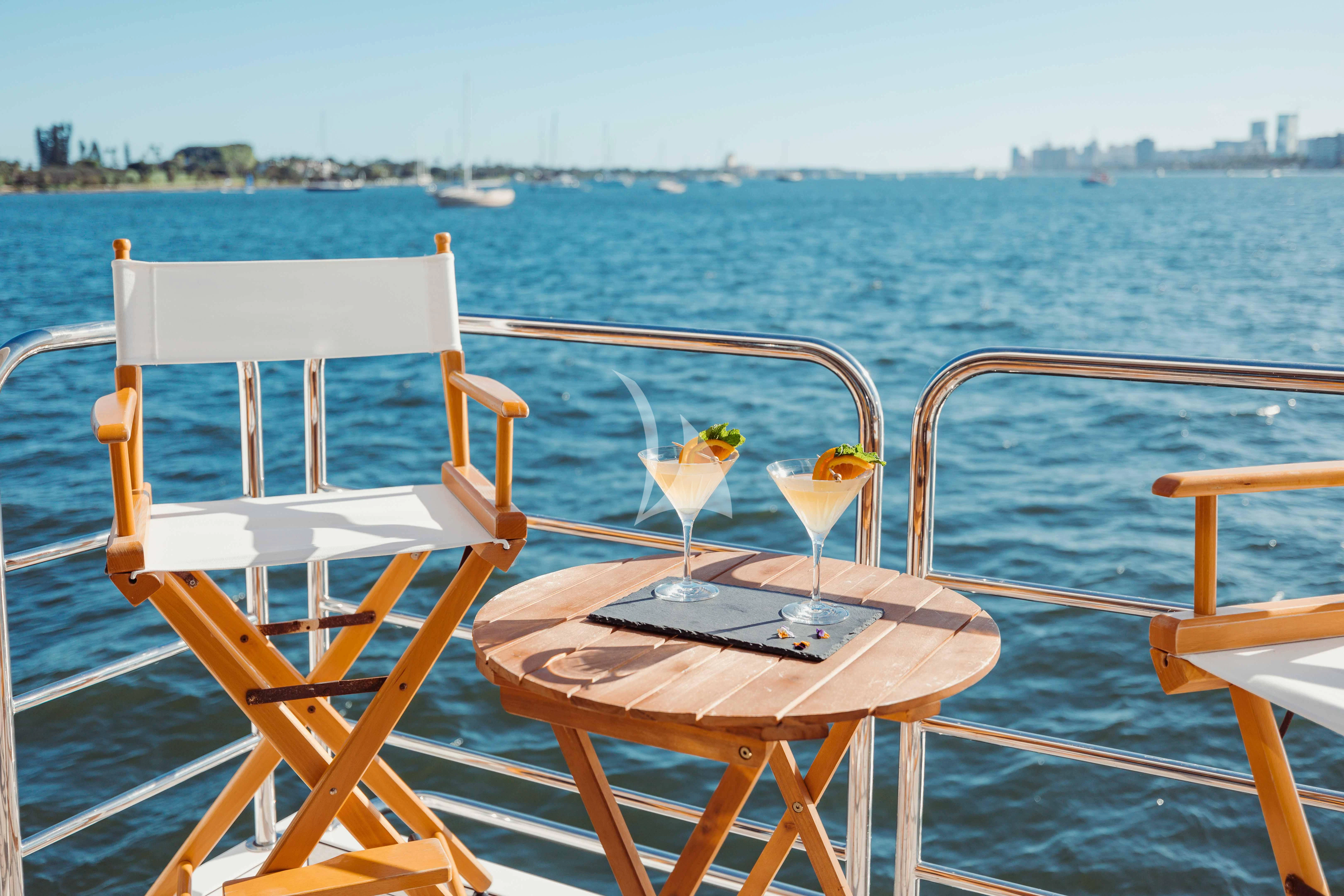 a table and chairs on a boat aboard ABOUT TIME Yacht for Sale