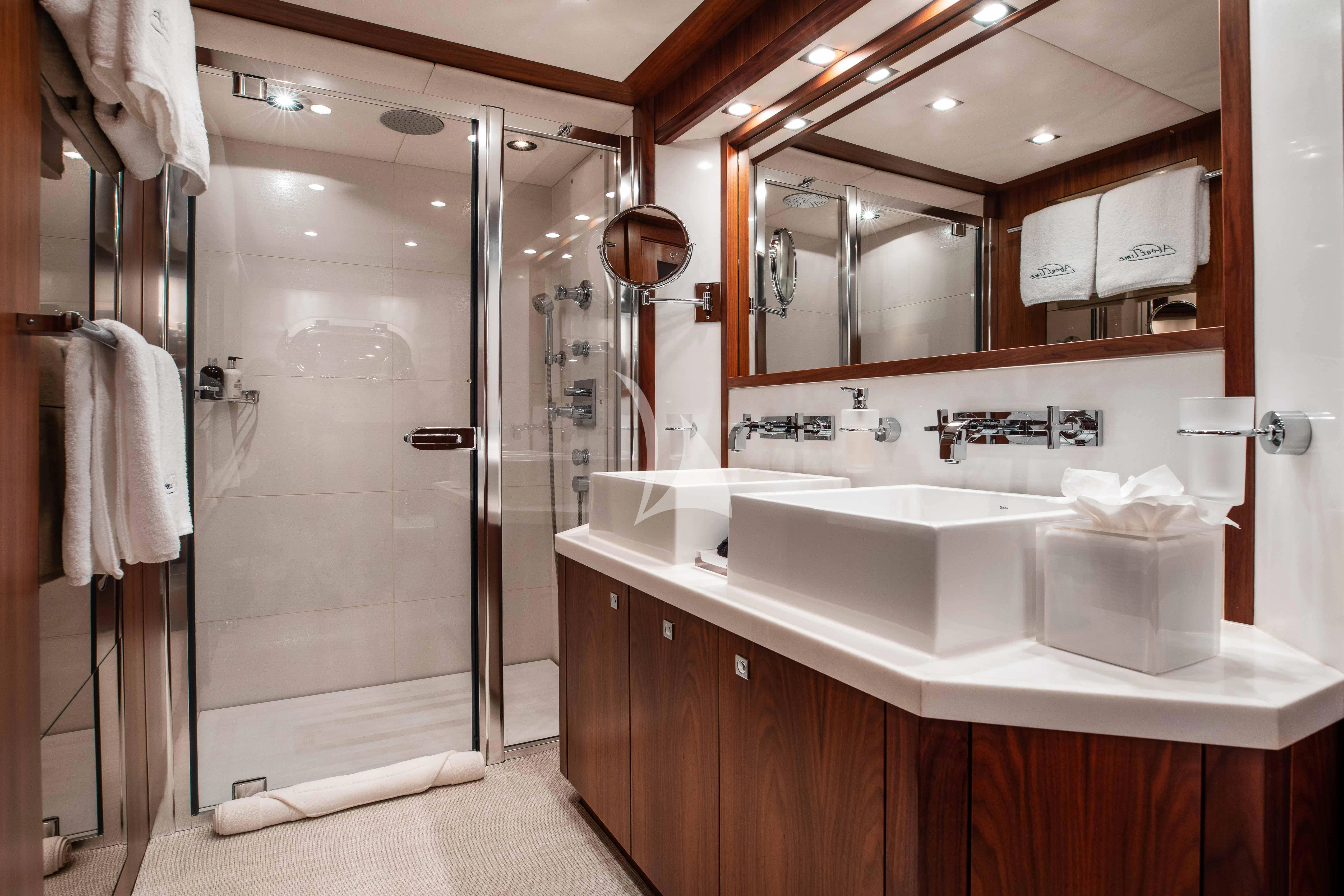 a bathroom with a large mirror aboard ABOUT TIME Yacht for Sale