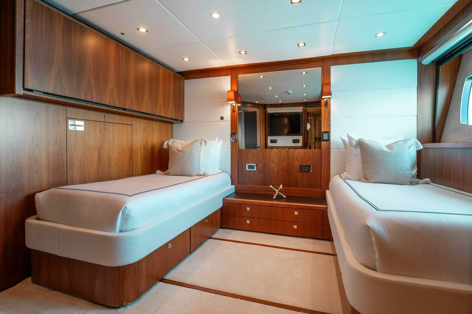 a room with a bed and a mirror aboard ABOUT TIME Yacht for Sale