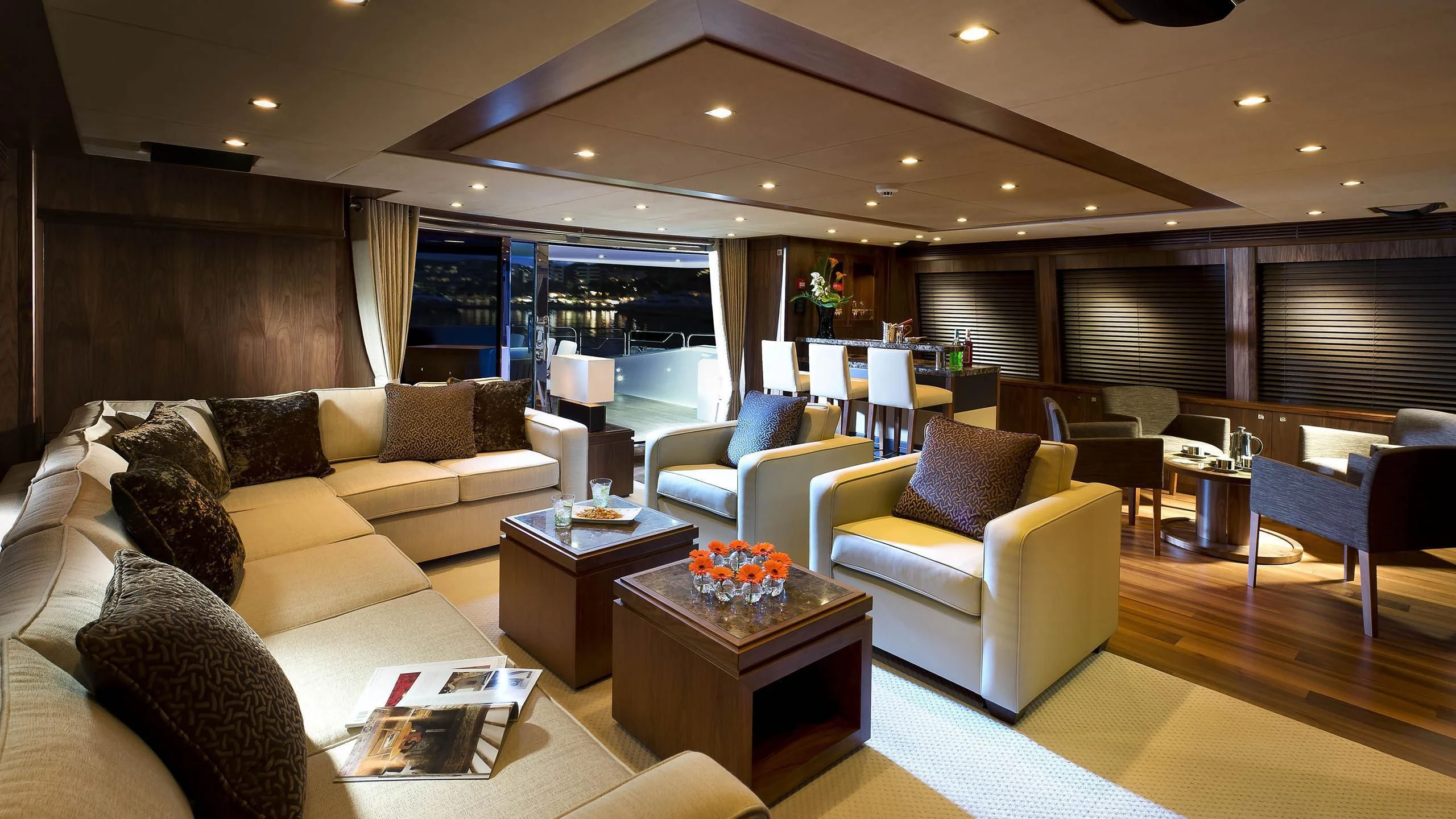 a living room with a couch and a coffee table aboard ABOUT TIME Yacht for Sale