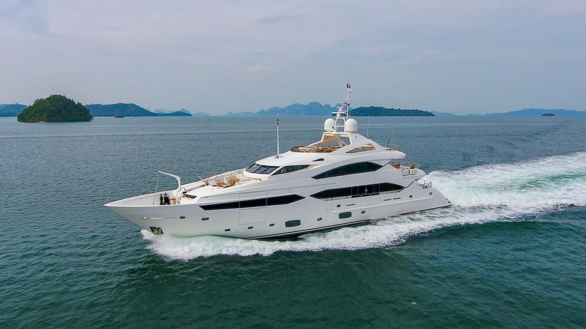 a white yacht in the water aboard ABOUT TIME Yacht for Sale