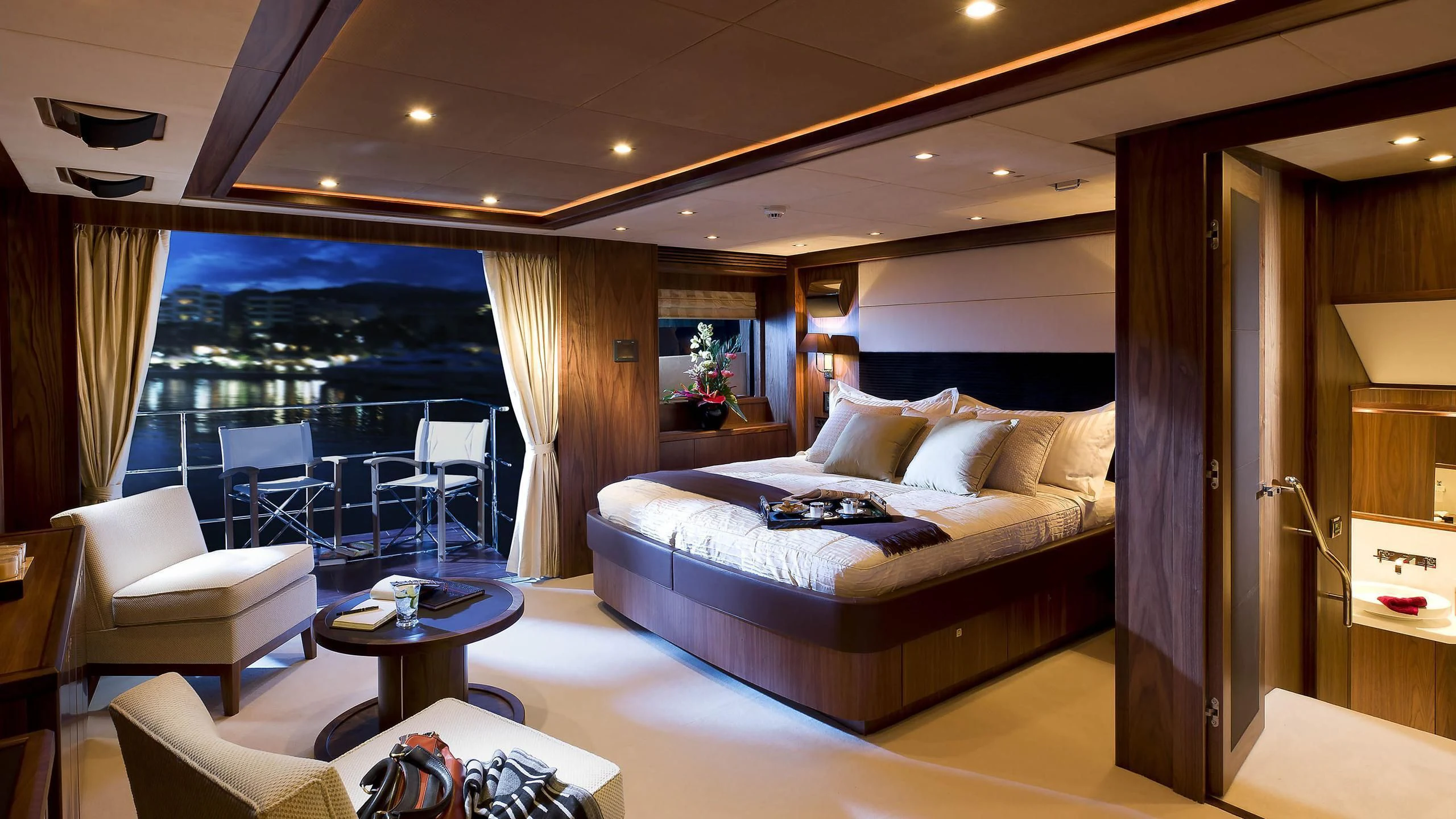 a hotel room with a bed and a table aboard ABOUT TIME Yacht for Sale