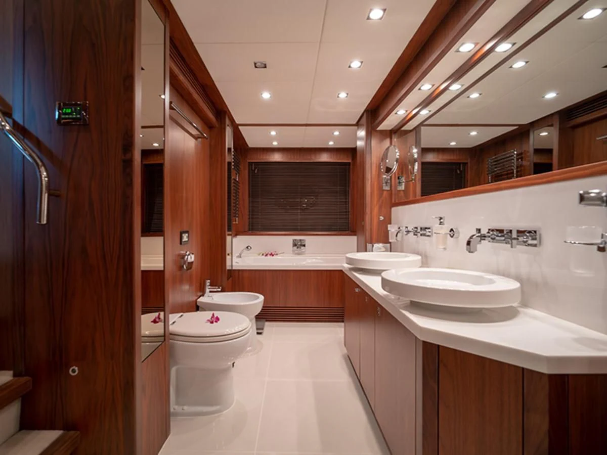 a bathroom with a sink and a toilet aboard ABOUT TIME Yacht for Sale