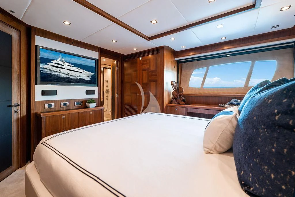 a bedroom with a large bed aboard ABOUT TIME Yacht for Sale