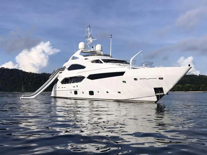 a white yacht on the water aboard ABOUT TIME Yacht for Sale