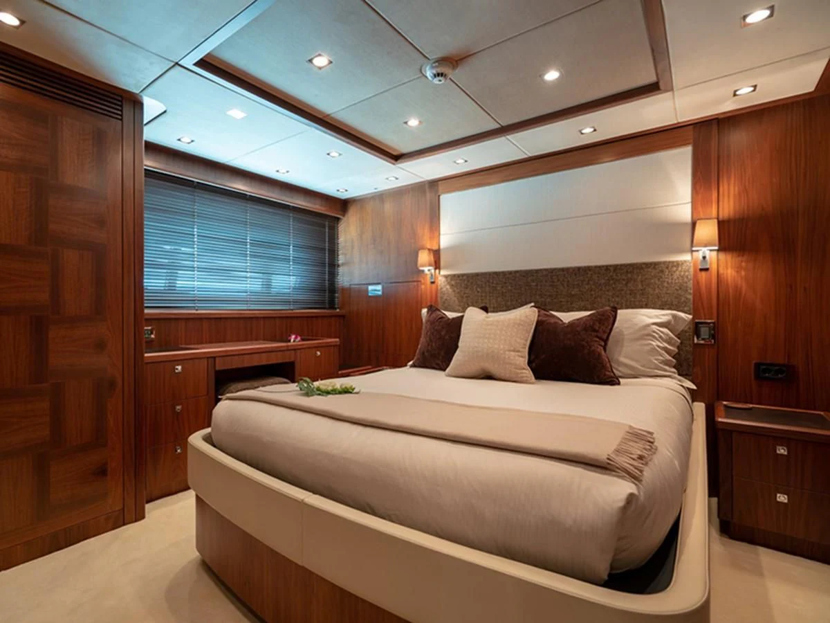 a bed in a room aboard ABOUT TIME Yacht for Sale