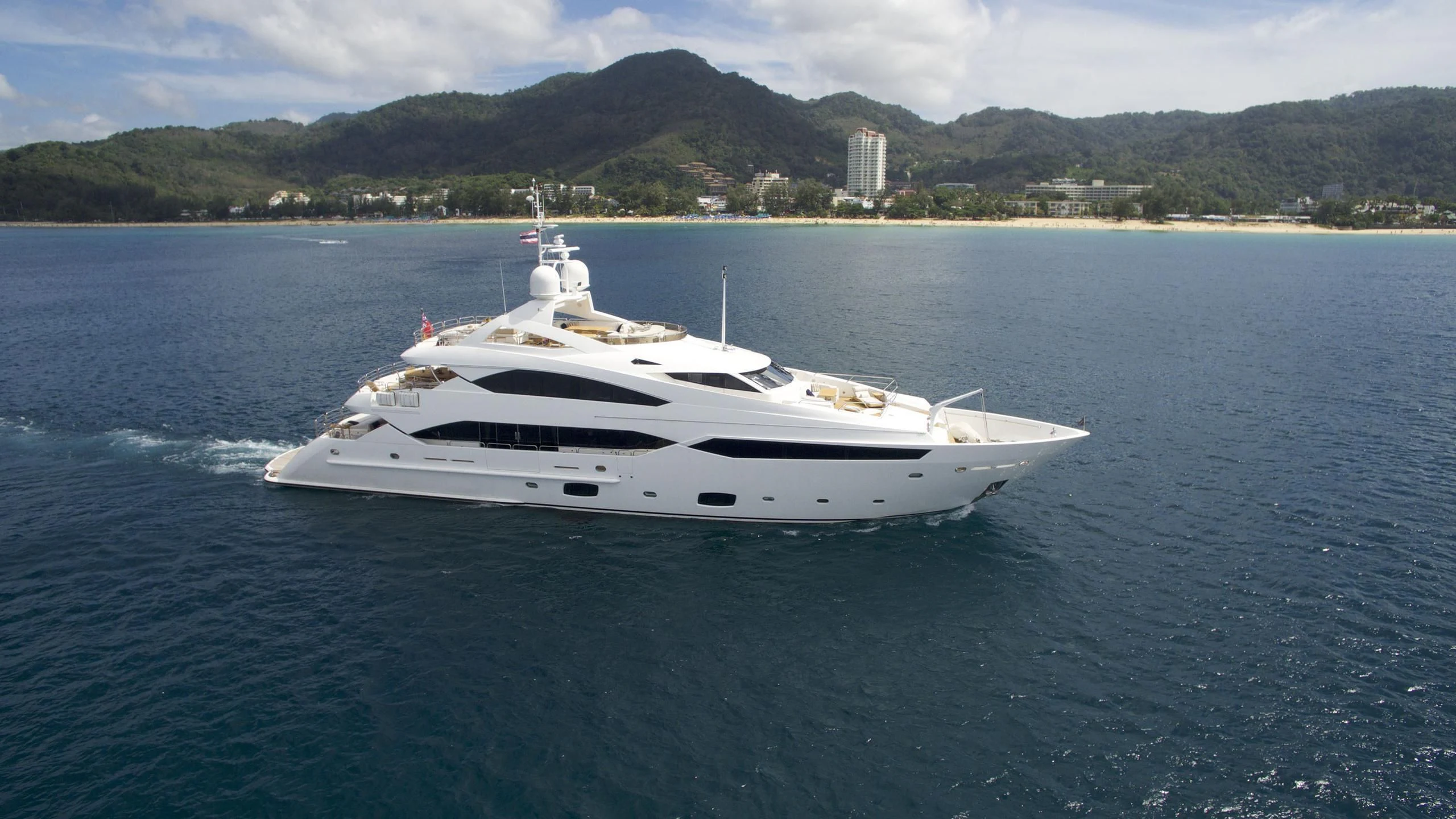 a white yacht on the water aboard ABOUT TIME Yacht for Sale