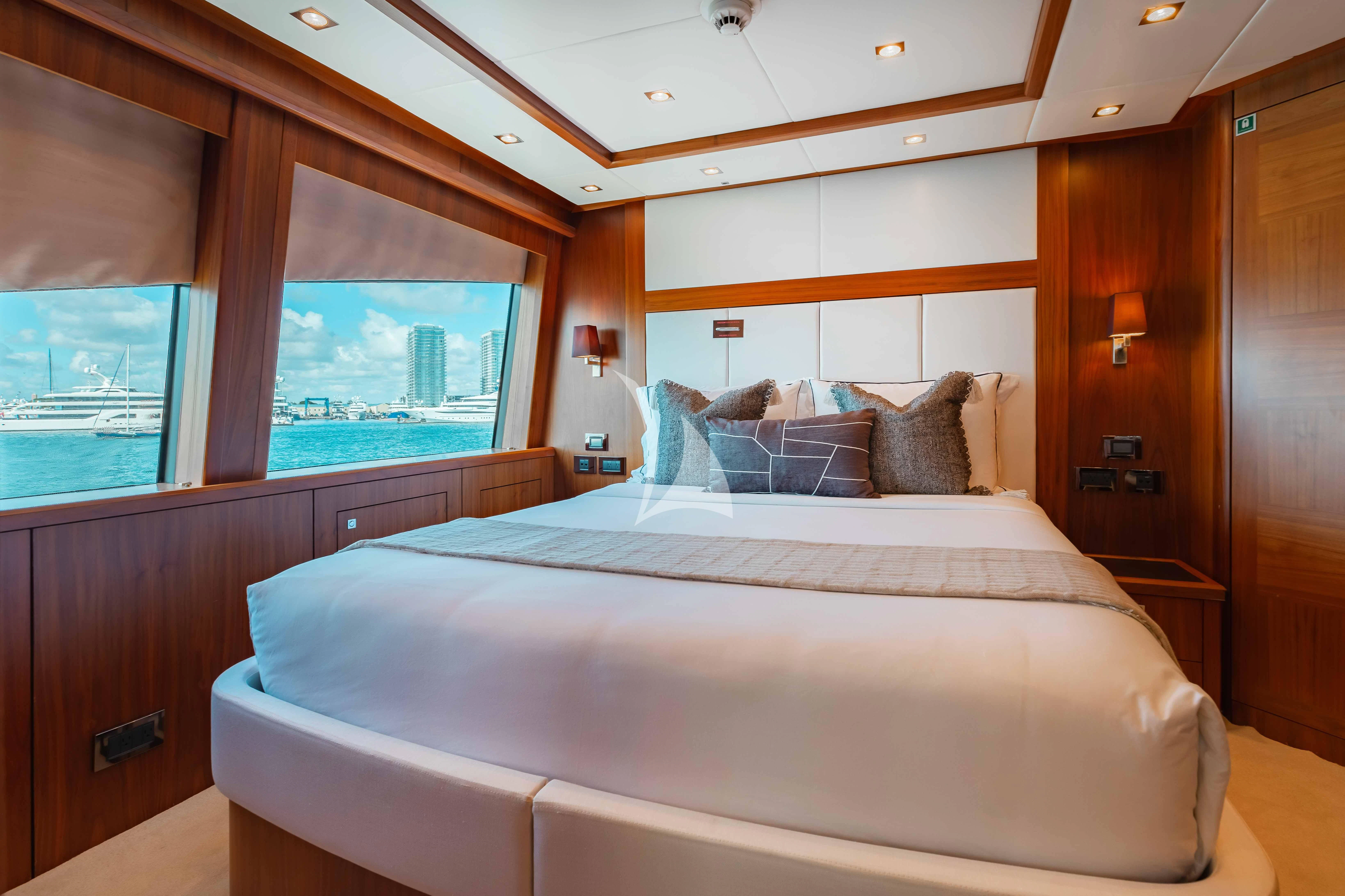 a bed in a room aboard ABOUT TIME Yacht for Sale