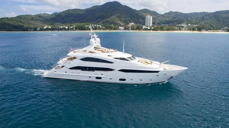 a white yacht on the water aboard ABOUT TIME Yacht for Sale