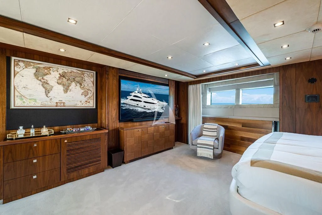 a room with a large television and a couch aboard ABOUT TIME Yacht for Sale
