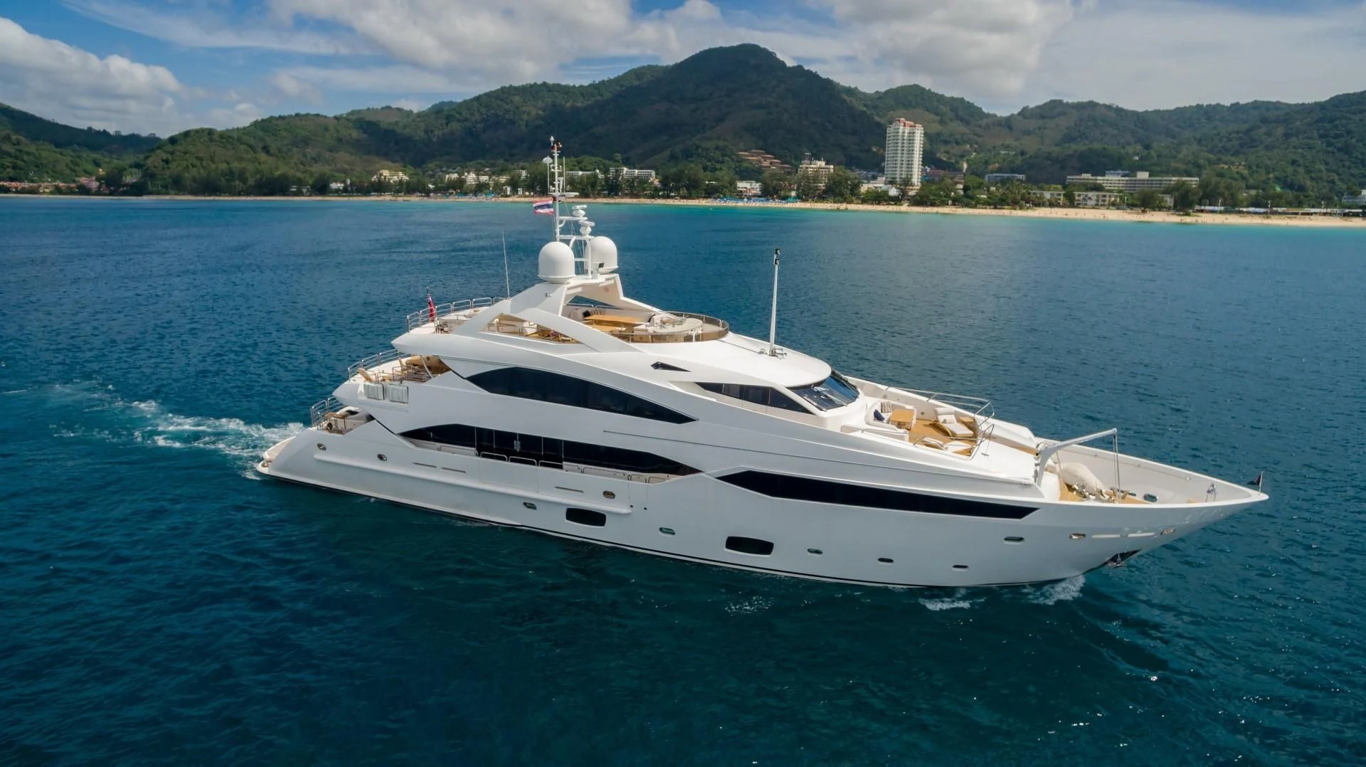 a white yacht on the water aboard ABOUT TIME Yacht for Sale