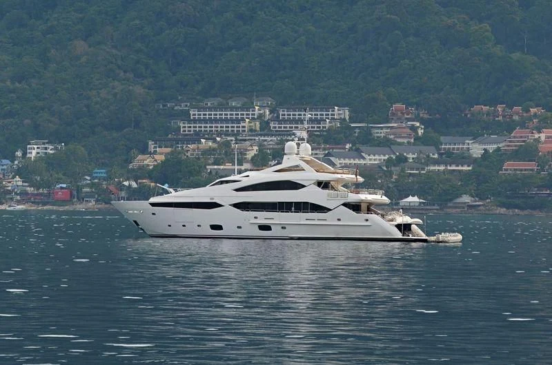 a white yacht on the water aboard ABOUT TIME Yacht for Sale
