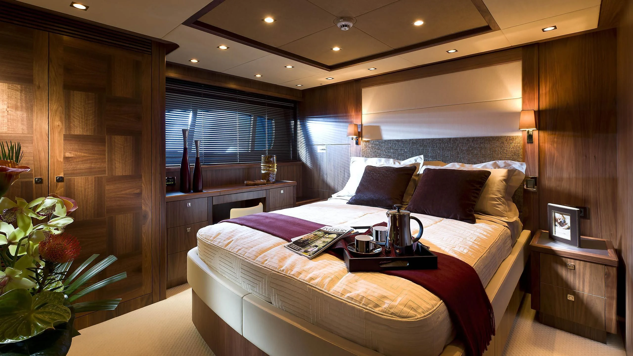 a room with a bed and a table aboard ABOUT TIME Yacht for Sale