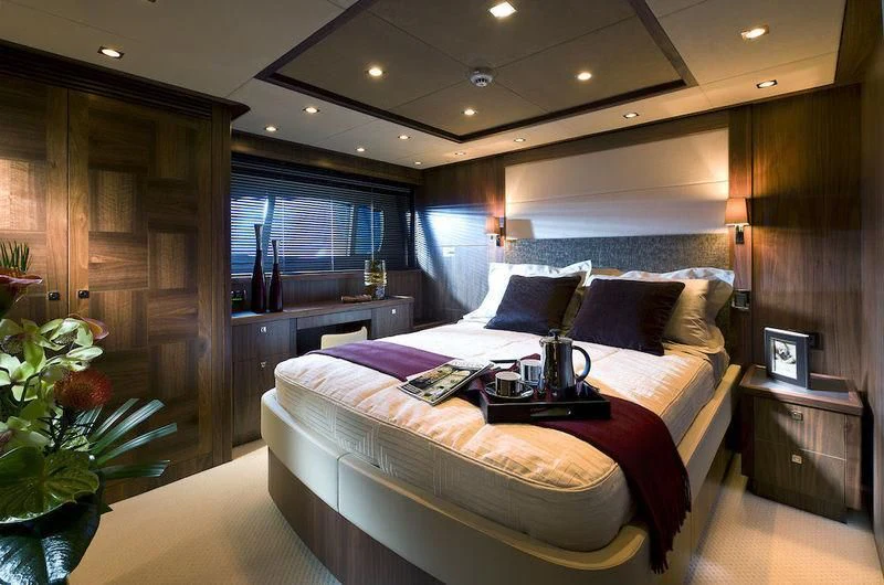a bed in a room aboard ABOUT TIME Yacht for Sale