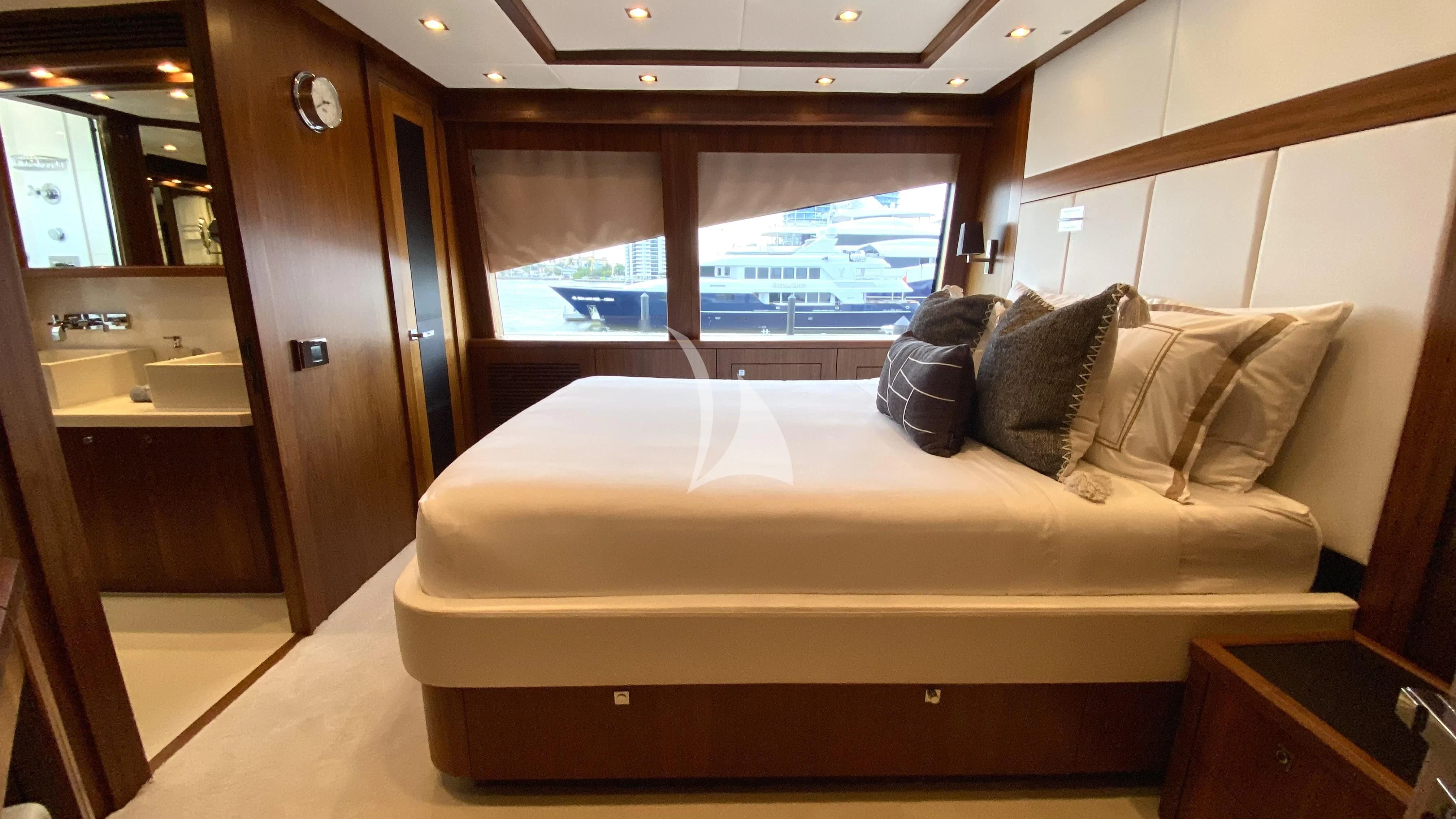a bed in a room aboard ABOUT TIME Yacht for Sale