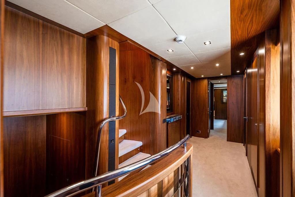 a hallway with wood cabinets aboard ABOUT TIME Yacht for Sale